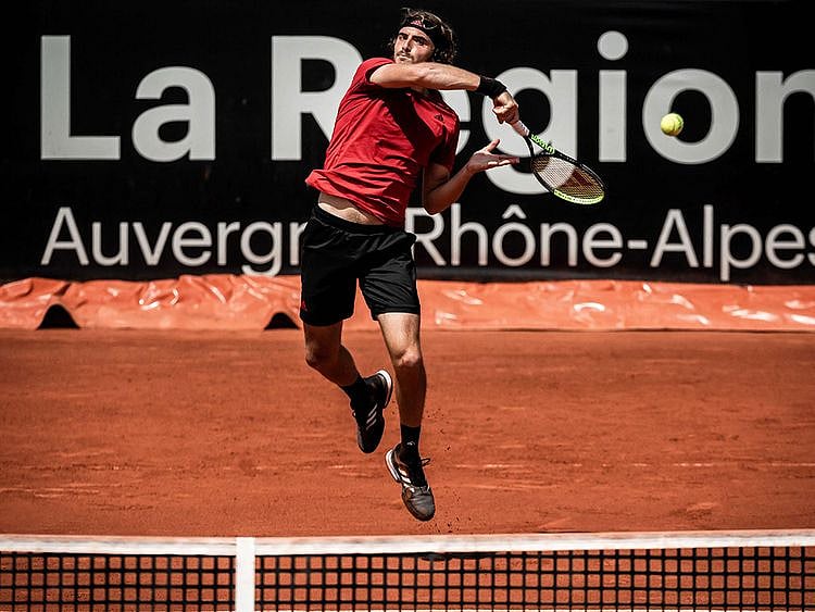 Greece's Stefanos Tsitsipas returns the ball to Britain's Cameron Norrie during the ATP 250 Lyon Open Parc final 