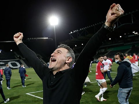 Lille's head coach Christophe Galtier celebrates after winning the Ligue 1 title