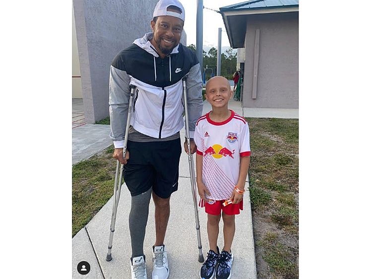 Tiger Woods with young fan Luna Perrone