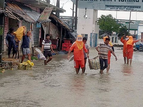 NDRF personnel rescues locals from waterlogged areas due to cyclone YAAS landfill in East Midnapore on Wednesday. 