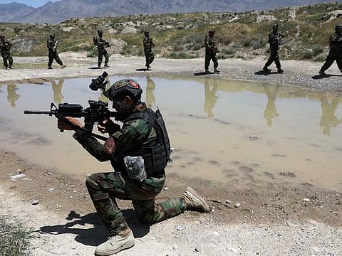 Afghan soldiers patrol outside their military base on the outskirts of Kabul, Afghanistan, Sunday, May 9, 2021. By Sept. 11 2021, at the latest, the remaining US and allied NATO forces will leave Afghanistan, ending nearly 20 years of military engagement. 