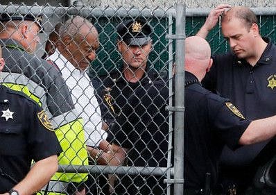 Actor and comedian Bill Cosby leaves the Montgomery County Courthouse in handcuffs after sentencing in his sexual assault trial in Norristown, Pennsylvania, US, September 25, 2018.