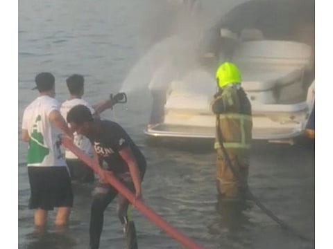 Civil defence officials bring the fire under control.