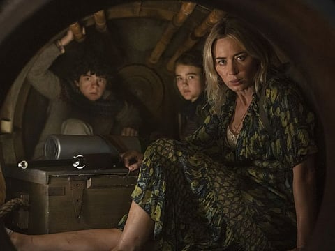 L-r, Marcus (Noah Jupe), Regan (Millicent Simmonds), and Evelyn (Emily Blunt) brave the unknown in "A Quiet Place Part II."