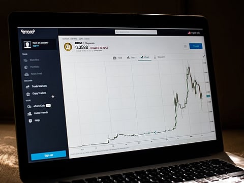 Dogecoin prices on the EToro website on a laptop computer arranged in Dobbs Ferry, New York, U.S., on Saturday, May 22, 2021.