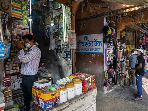A vendor prays at a store in the walled city of Jaipur, Rajasthan, India, on Thursday, June 3, 2021.