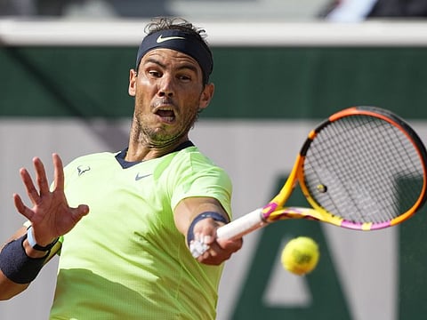 Spain's Rafael Nadal plays a return to Britain's Cameron Norrie during their third round match on day 7, of the French Open tennis tournament at Roland Garros in Paris, France.