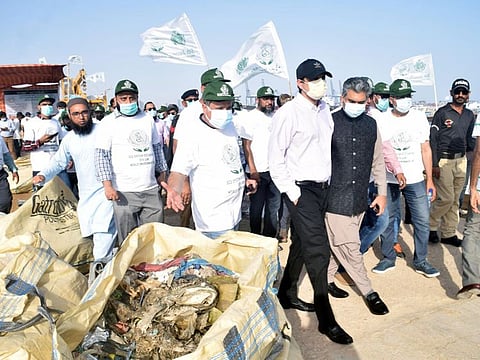 Sindh Law and Environment, Barrister Murtaza Wahab, along with other senior officials, inspects garbage collected from Arabian Sea along Karachi's coastline. 
