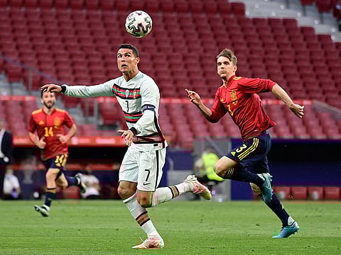 Diego Llorente chases Cristiano Ronaldo in a recent friendly between Spain and Portugal.