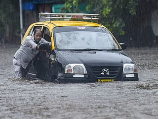 Photos: Heavy rains lash Mumbai; train, traffic services hit