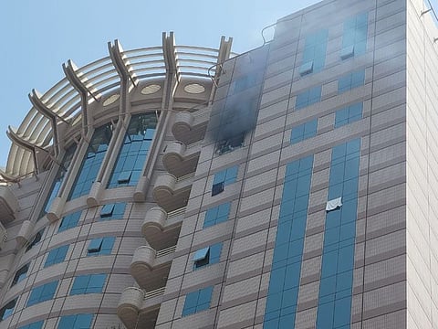 Smoke billowing from the apartment in Al Riqqa, Dubai, where a fire broke out on Wednesday morning.