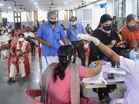 People at a COVID-19 vaccination centre in Kochi. Indian businessman Ravi Pillai on Thursday announced a Rs150 million (Dh7.5 million) COVID-19 relief fund for the benefit of his compatriots from Kerala — including expatriate Keralites living in the UAE. 