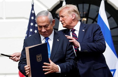 Israel's Prime Minister Benjamin Netanyahu with US President Donald Trump after signing the Abraham Accords on the South Lawn of the White House in Washington on September 15, 2020. 