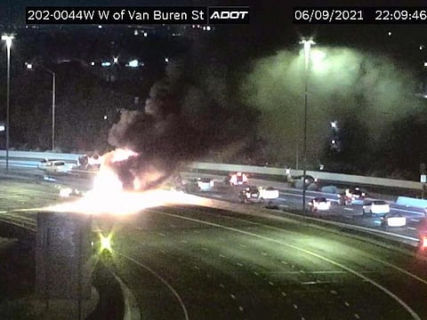 This image from an Arizona Department of Transportation remote traffic camera shows the scene of a crash involving a milk tanker truck in Phoenix on Wednesday, June 9, 2021. 