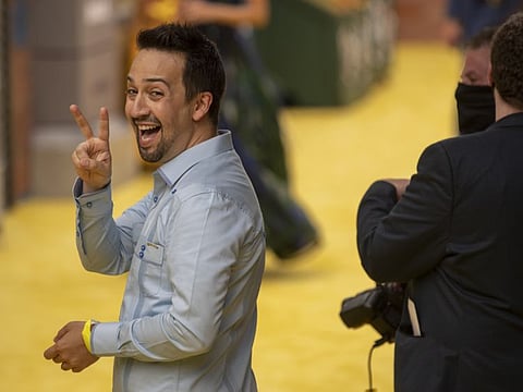 Lin-Manuel Miranda, actor and co-producer of the movie "In the Heights," makes a peace sign ahead of a screening of "In the Heights" at the Tribeca Film Festival outside the United Palace Theater in New York, U.S., on Wednesday. June 9, 2021.