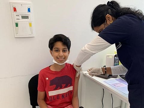 12-year-old Siddharth Menon takes his first COVID-19 vaccine dose.