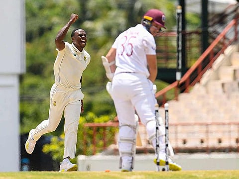 Kagiso Rabada (L) of South Africa celebrates the dismissal of Joshua de Silva (R) of West Indies during day 3 of the 1st Test at Darren Sammy Cricket Ground, Gros Islet, Saint Lucia. 