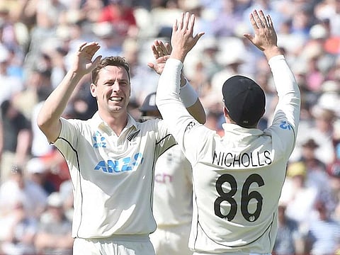 New Zealand's Matt Henry, left, celebrates with teammates the dismissal of England's Zak Crawley during the match at Edgbaston in Birmingham. 