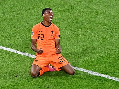 Netherlands' Denzel Dumfries celebrates scoring the late winner.