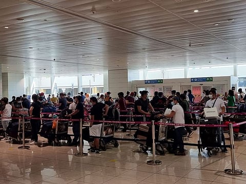Stranded seafarers wait to board a chartered flight  at Dubai Airport on Monday.