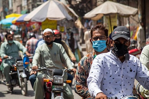 A busy Hall Road in Lahore, Pakistan. Pakistan decided to relax several COVID-19 restrictions, opening schools, restaurants and gyms, after witnessing a significant decline in coronavirus cases since early June.