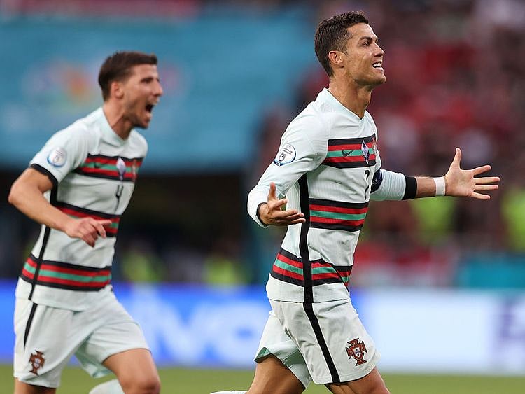 Cristiano Ronaldo celebrates scoring Portugal's third goal against Hungary at Euro 2020