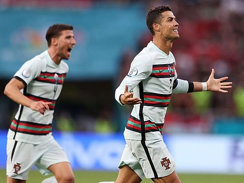 Cristiano Ronaldo celebrates scoring Portugal's third goal against Hungary at Euro 2020