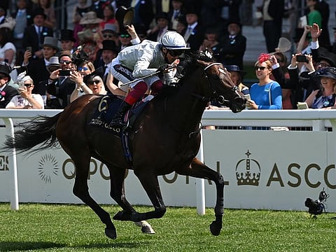Frankie Dettori, riding Palace Pier, wins the Queen Anne Stakes on the first day of the Royal Ascot meet, in Ascot, west of London today. Royal Ascot is preparing to open its doors to 12,000 racing fans a day but the coronavirus will still take a significant financial toll on the event. 