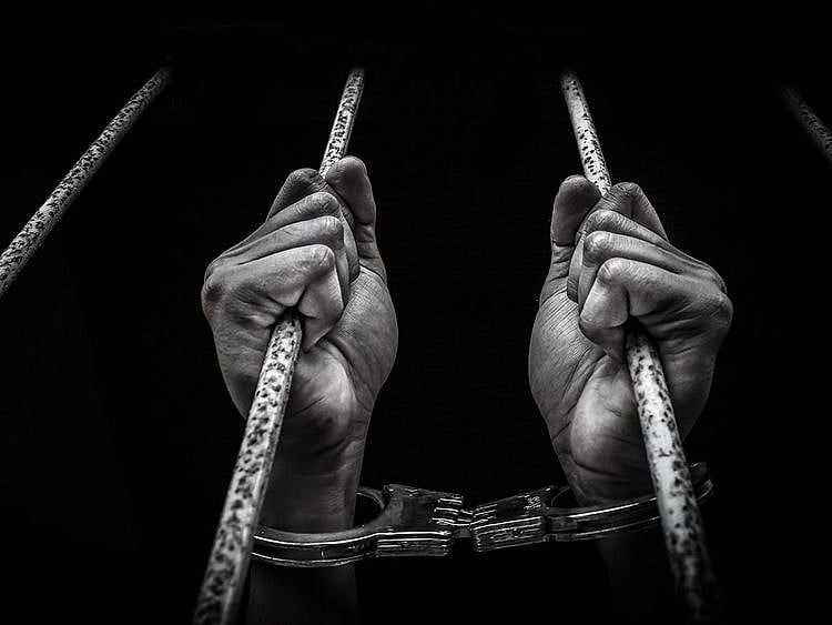 STOCK jailed prison handcuff crime