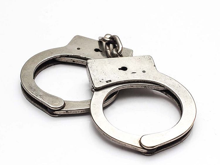 STOCK jailed prison handcuff crime