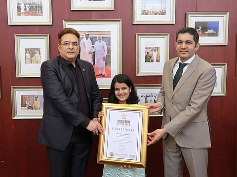 Sara Chhipa with Dr Aman Puri (right), Consul General of India in Dubai and Dr Jitendra Matlani, Vice-President, World Book of Records, at the Consulate General of India in Dubai.