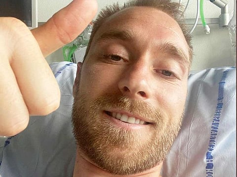 Danish footballer Christian Eriksen gives a thumbs-up at Rigshospitalet, where he is treated after he collapsed during a UEFA Euro 2020 game on Saturday, in Copenhagen, Denmark, in this picture obtained from social media.  