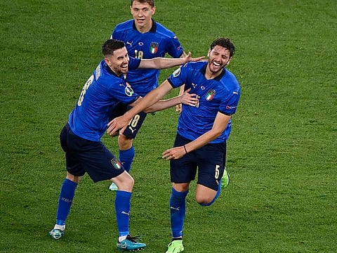 Italy's Manuel Locatelli celebrates scoring their second goal with Jorginho.