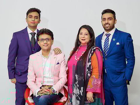 Anis Sajan with his wife, Rubina Sajan, and sons, Azhar (23) and Sahil (20).