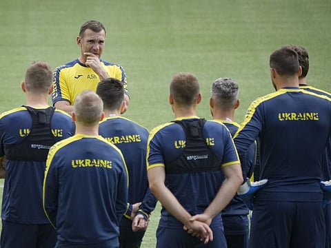 Ukraine's head coach Andriy Shevchenko speaks to players during the team's training session at the Arcul de Triumf stadium in Bucharest, Romania. Ukraine will face North Macedonia today.