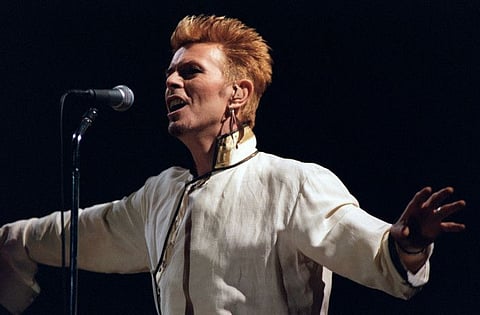 In this file photo taken on June 14, 1997 British singer David Bowie performs on stage, during a concert at the Parc des Princes, on the first day of the rock festival in Paris .