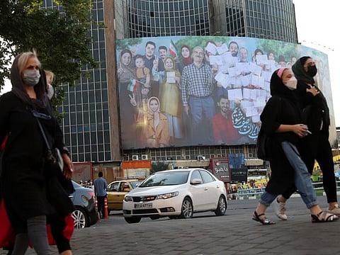 A banner of the presidential election in Valiasr square in Tehran. President Hassan Rouhani, a relative moderate, urged Iranians on Thursday, as campaigning ended, not to let the shortcomings of an institution or a group keep them from voting, an apparent reference to the Guardian Council.