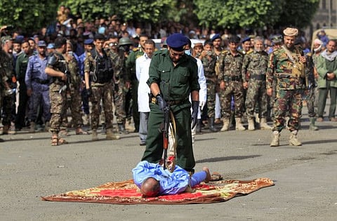 Yemeni Houthi militia's security forces prepare to execute a man convicted of killing his three daughters in Sana'a's Tahrir Square. 