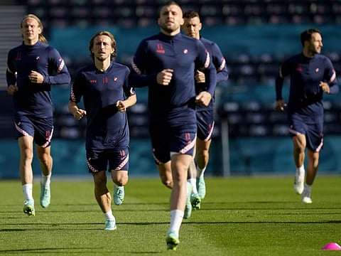 Croatia's Luka Modric (second left) runs with his teammates during a training session at the Hampden Park Stadium in Glasgow the day before their Group D Euro match against Czech Republic.