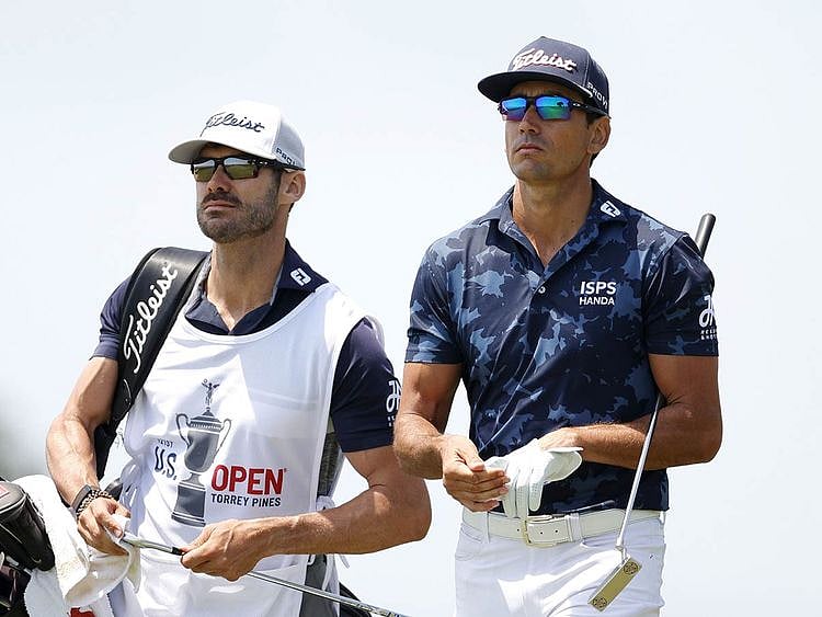 Rafa Cabrera Bello walks with his caddie and brother Miguel Cabrera Bello  