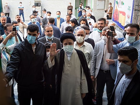 Ebrahim Raisi, judiciary chief, arrives to cast his vote in the presidential election in Tehran, Iran, on Friday, June 18.