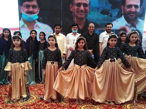  Children perform during the groundbreaking ceremony for the school.
