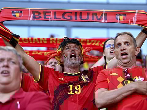 Belgium fans cheer during the Euro 2020 championship Group B match against Denmark at the Parken stadium in Copenhagen.