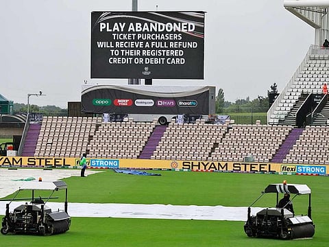An announcement is displayed on a large screen that the play for the day has been abandoned on the fourth day of the World Test Championship final cricket match between New Zealand and India, at the Rose Bowl in Southampton, England, on June 21, 2021. 