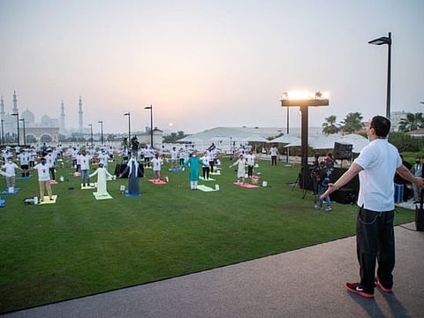Sheikh Nahyan bin Mabarak Al Nahyan, UAE’s Minister of Tolerance and Coexistence, and Indian Ambassador to the UAE Pavan Kapoor along with others practice Yoga during the International Day of Yoga event in Abu Dhabi