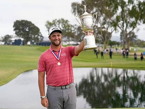 Jon Rahm, depending champion of US Open, with the winner's trophy at Torrey Pines last year. 