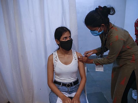 A girl receives COVAXIN vaccine for COVID-19 at a vaccination centre in Mumbai on June 22, 2021. The government said while the two vaccines being used in India, Serum Institute of India’s Covishield and Bharat Biotech’s Covaxin, are effective against the Delta variant, data on how they work on the Delta Plus would be shared later.