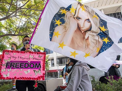 (FILES) In this file photo taken on April 27, 2021 supporters of the FreeBritney movement rally in support of musician Britney Spears following a conservatorship court hearing in Los Angeles, California. - Under a controversial legal guardianship since 2008, US pop singer Britney Spears is scheduled to address a Los Angeles court on June 23, 2021 in the battle over her father's control of her affairs. (Photo by VALERIE MACON / AFP)