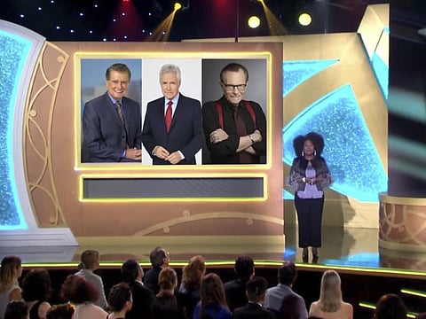 In this video image provided by NATAS and the Daytime Emmys, host Sheryl Underwood introduces a tribute to the late talk show hosts, pictured on screen from left, Regis Philbin, Alex Trebek and Larry King during the 48th Daytime Emmy Awards.