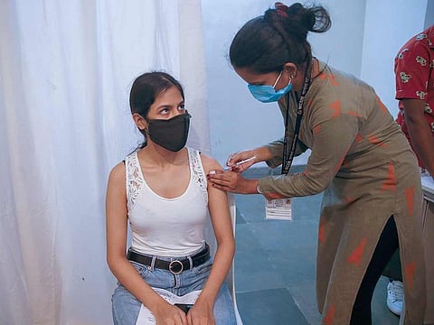 A nurse administers Covaxin vaccine against the coronavirus during a vaccination for those above age 18 in Mumbai, India. 